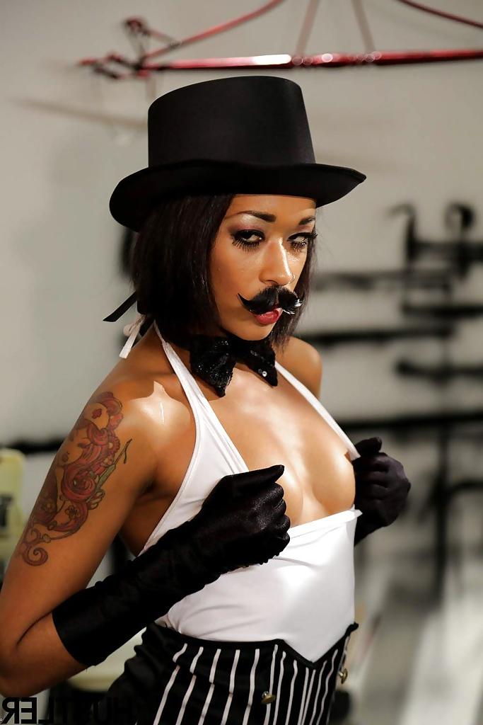 16P Ebony pornstar Skin Diamond strutting in vintage hat and long gloves
