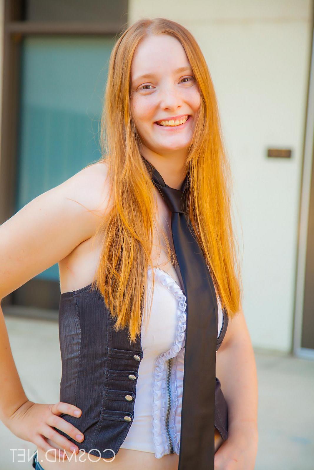 14P Pretty natural redhead Julia Flemming exposes her boobs in her debut shoot