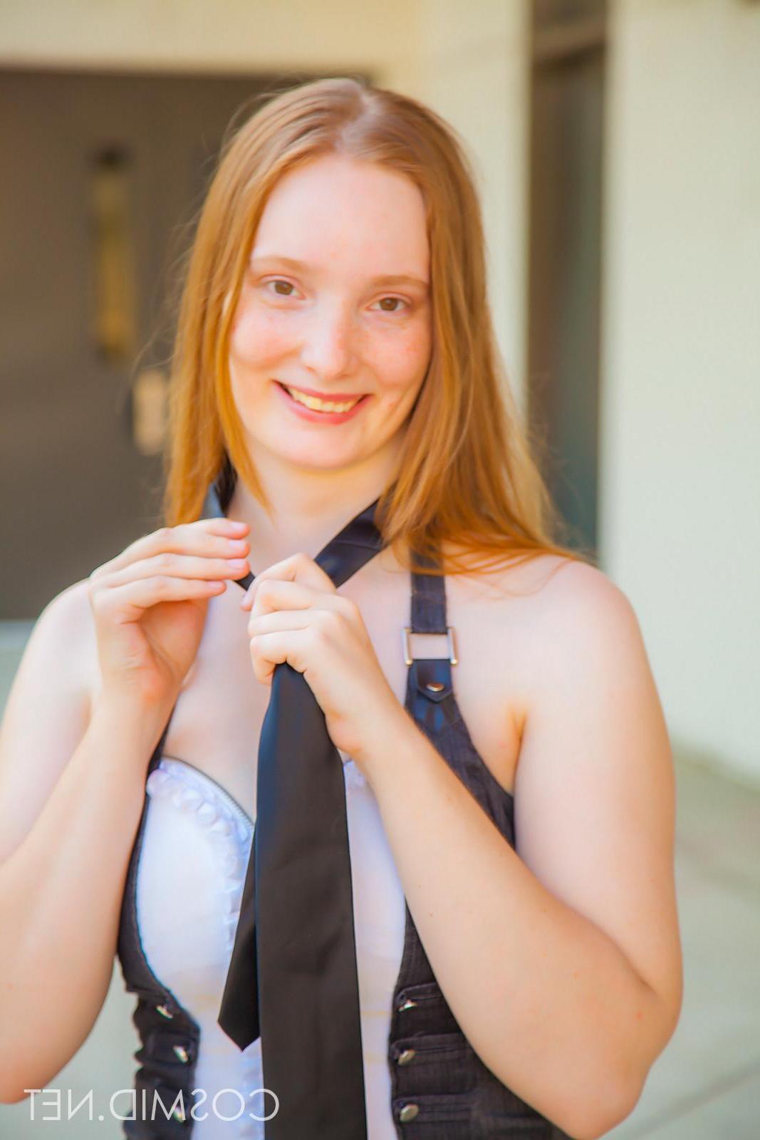 14P Pretty natural redhead Julia Flemming exposes her boobs in her debut shoot