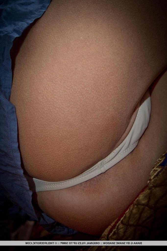 16P Brunette beauty July Saint peels off her underwear to reveal her tight pussy