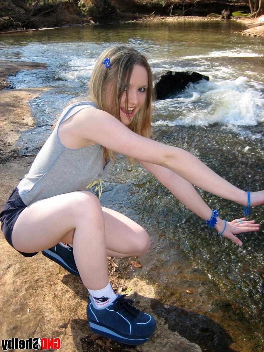 12P Cute teen Shelby flashes her perky tit while at the park down by the creek
