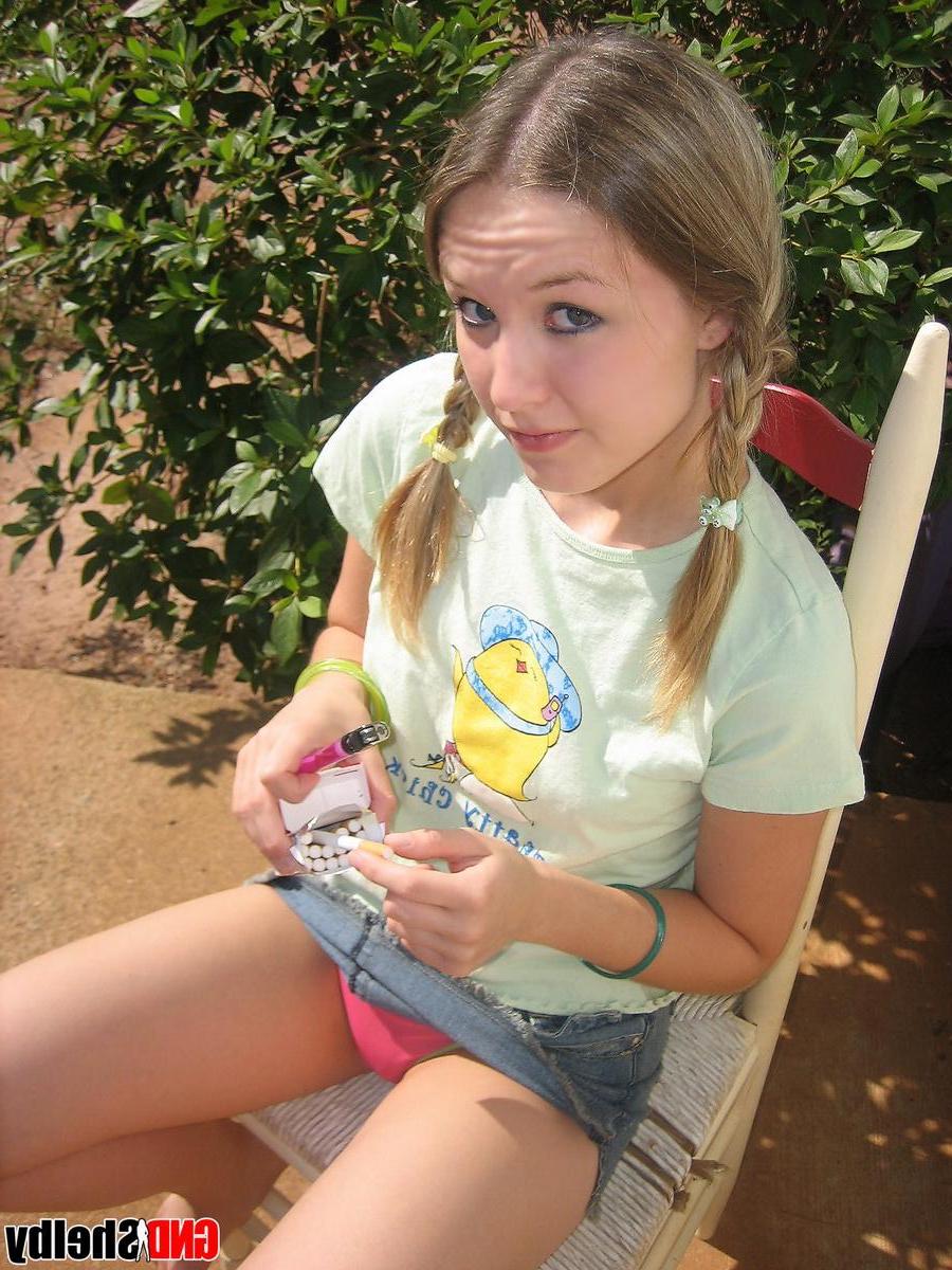 12P Cute teenage babe Shelby takes a smoke break and flashes us her perky tits