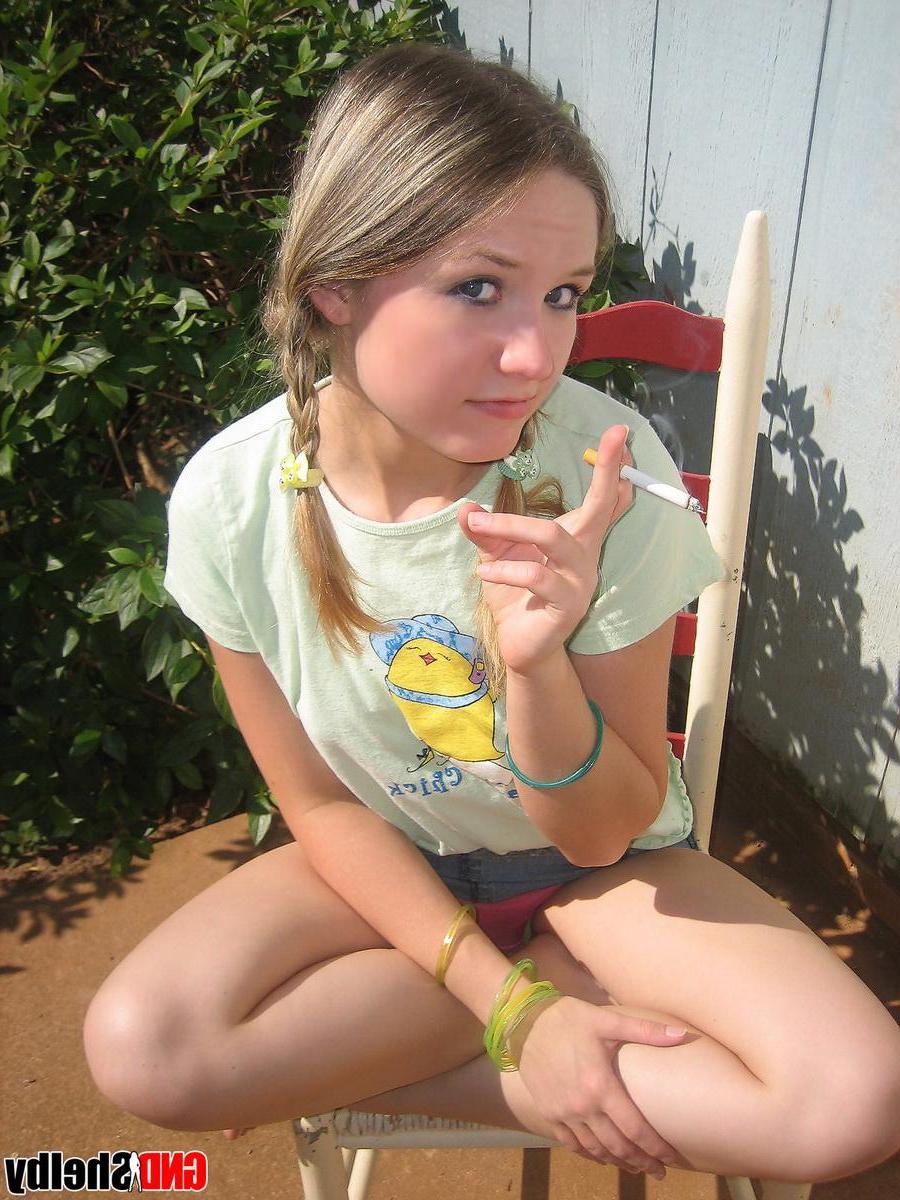 12P Cute teenage babe Shelby takes a smoke break and flashes us her perky tits
