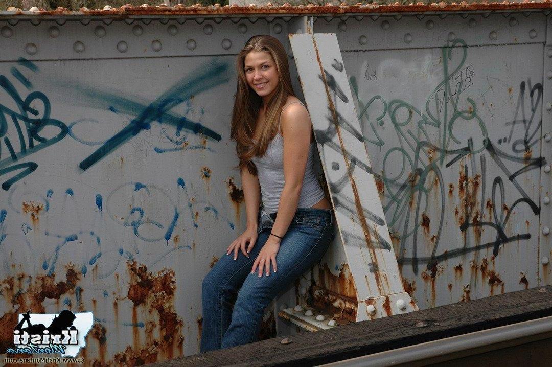 15P Pictures of teen star Kristi Montana exposing her tits on the train tracks