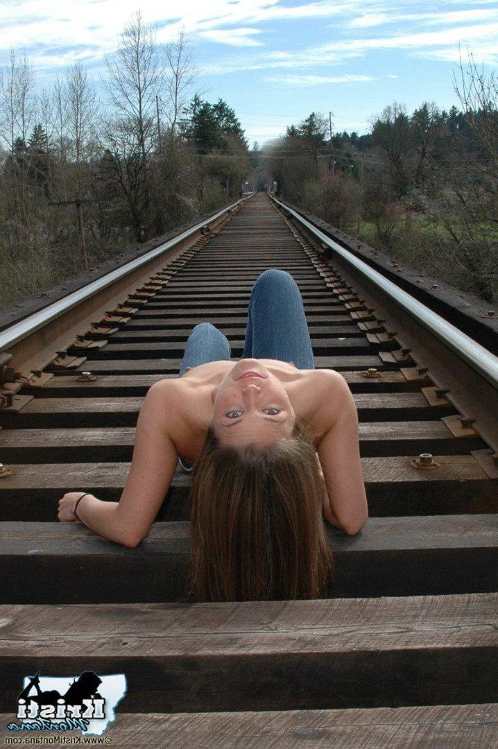 15P Pictures of teen star Kristi Montana exposing her tits on the train tracks