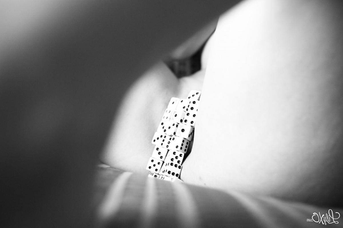 15P Lily Xo hides her goodies with dice in black and white on the couch