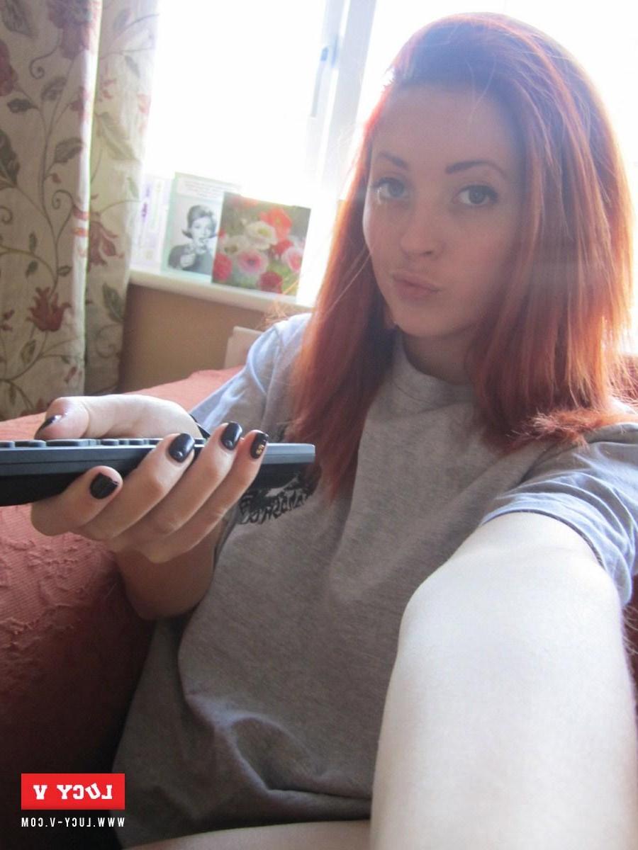 9P Redhead model Lucy V strips from her cute little shorts at home