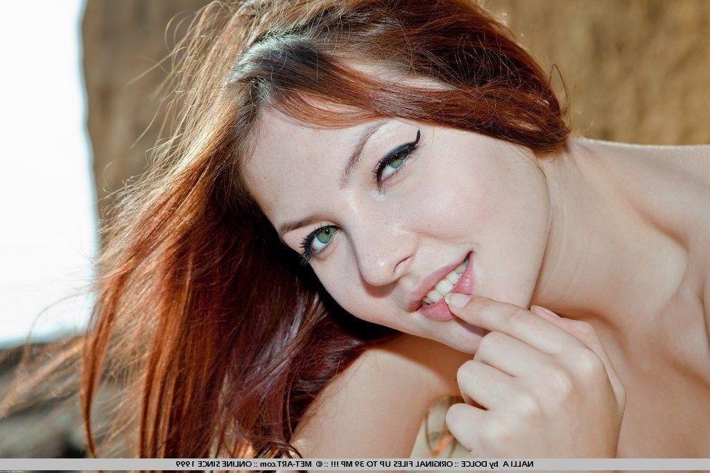 19P Pictures of Nalli A showing her nude body on the beach