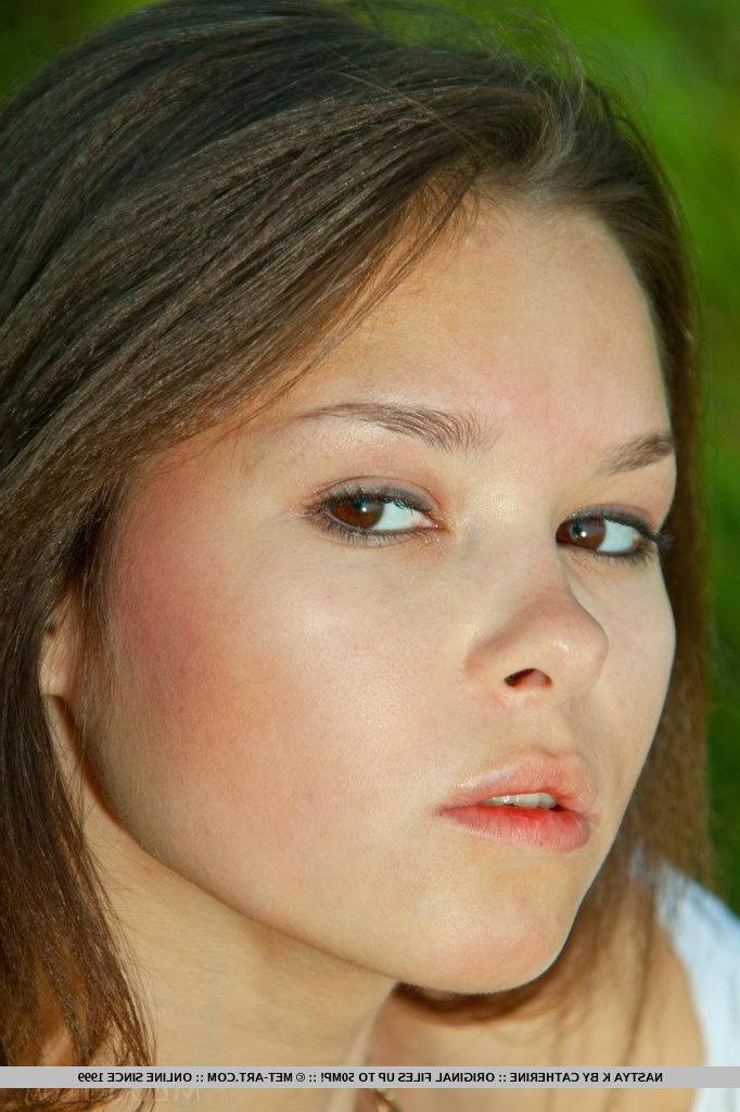 18P Brunette teen Nastya strips nude and shows her pussy outside