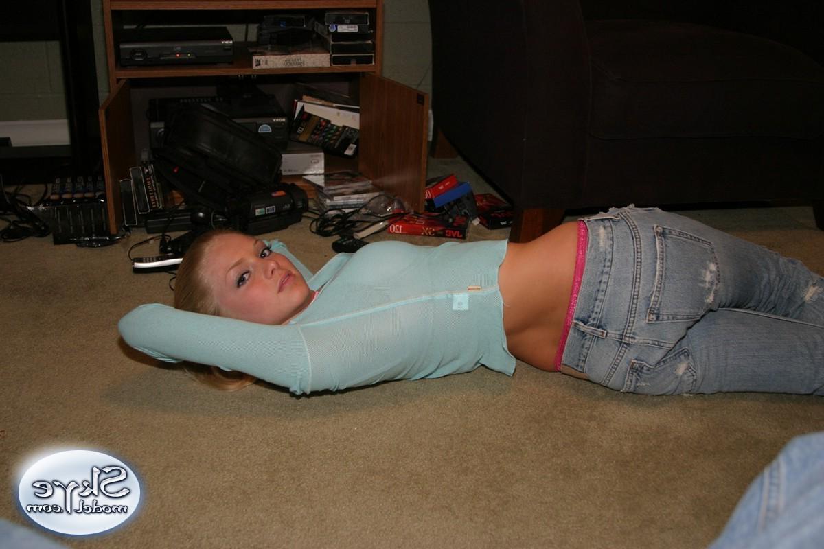 12P Cute teen Skye Model shows off her perky tits in a very low cut top