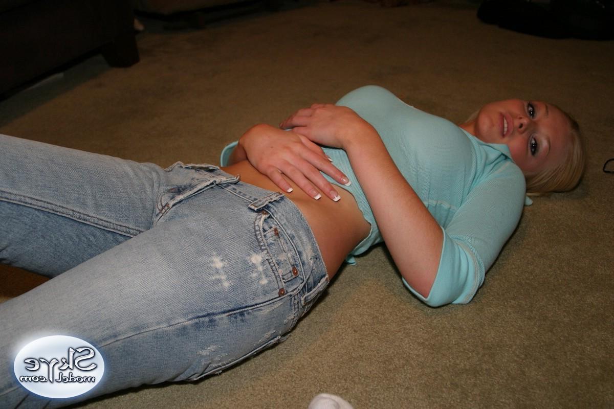 12P Cute teen Skye Model shows off her perky tits in a very low cut top