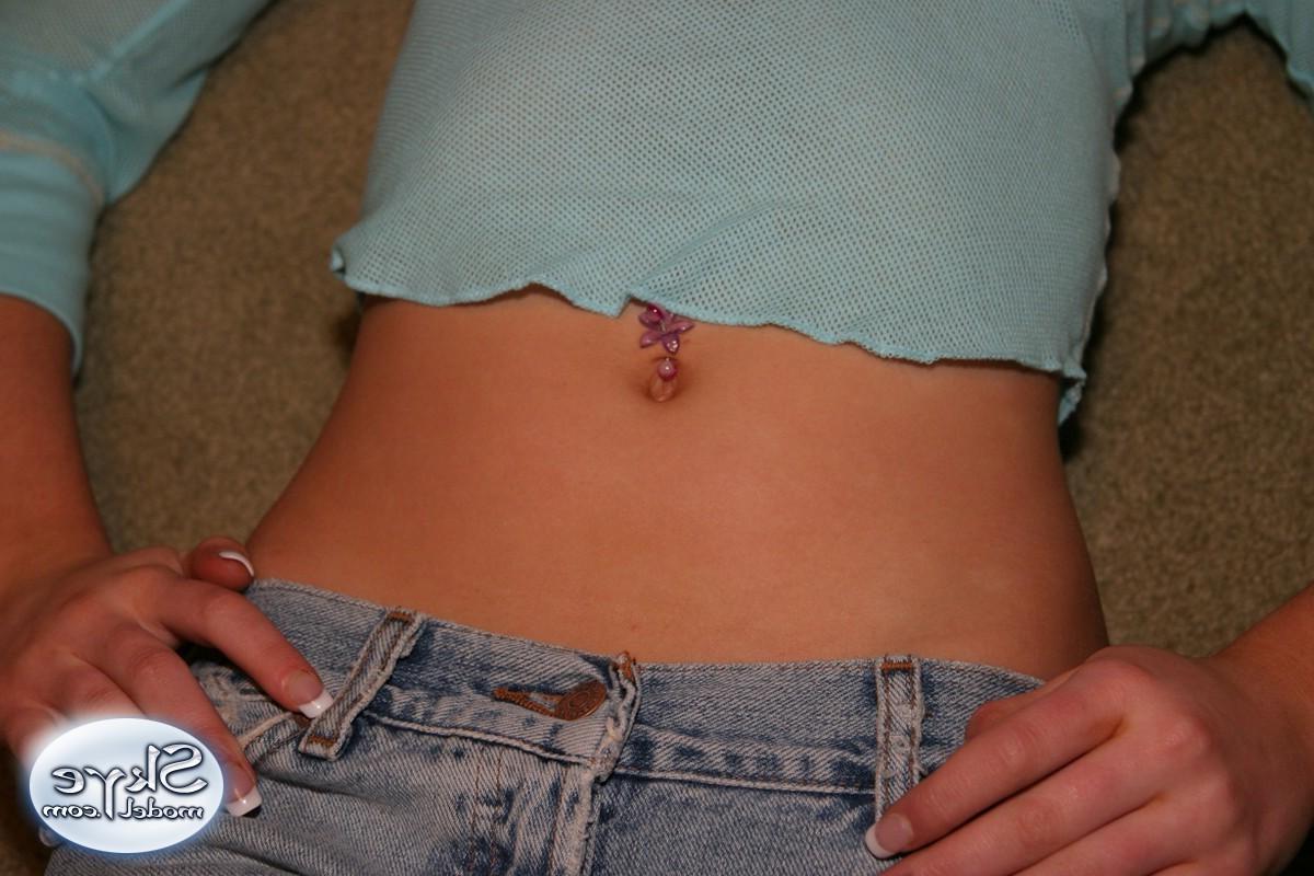 12P Cute teen Skye Model shows off her perky tits in a very low cut top