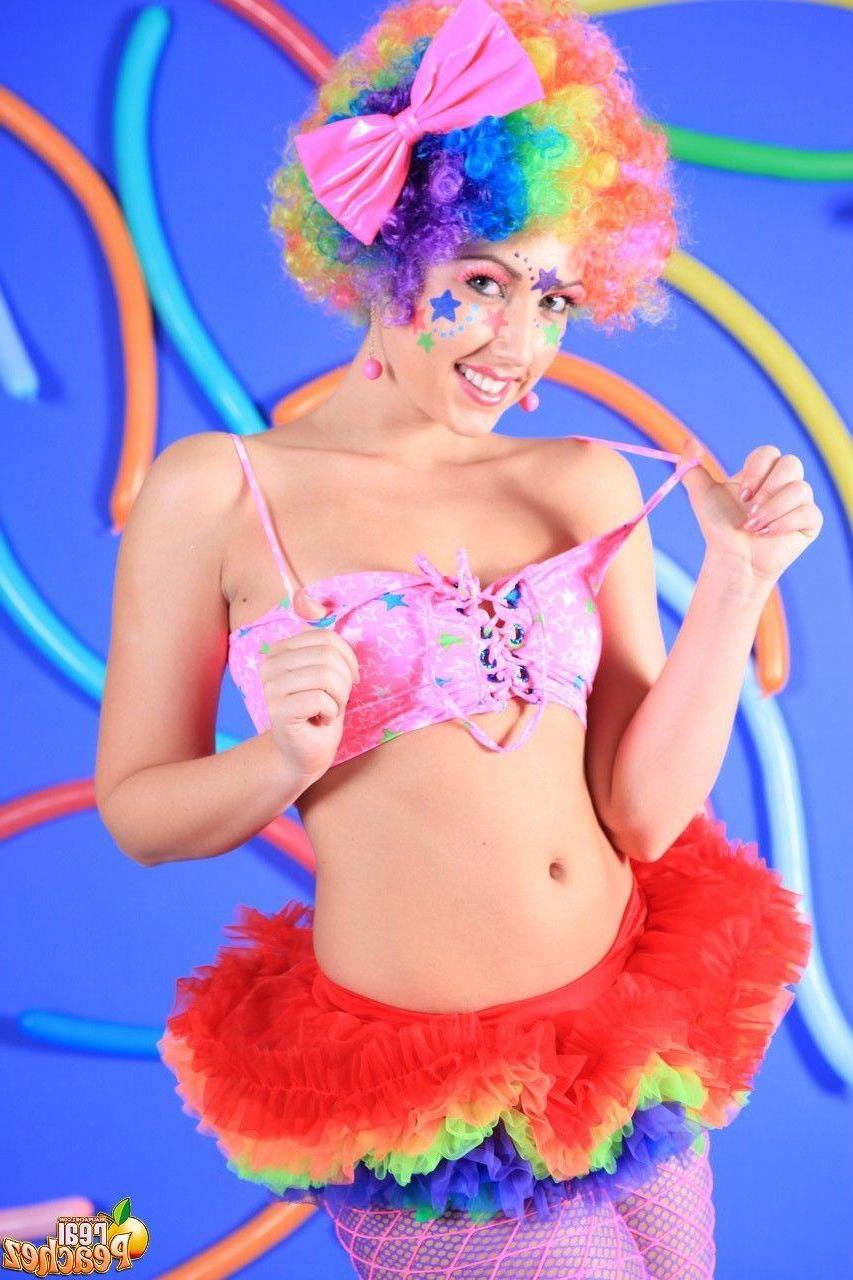 15P Pictures of teen hottie Real Peachez dressed as a slutty harlequin