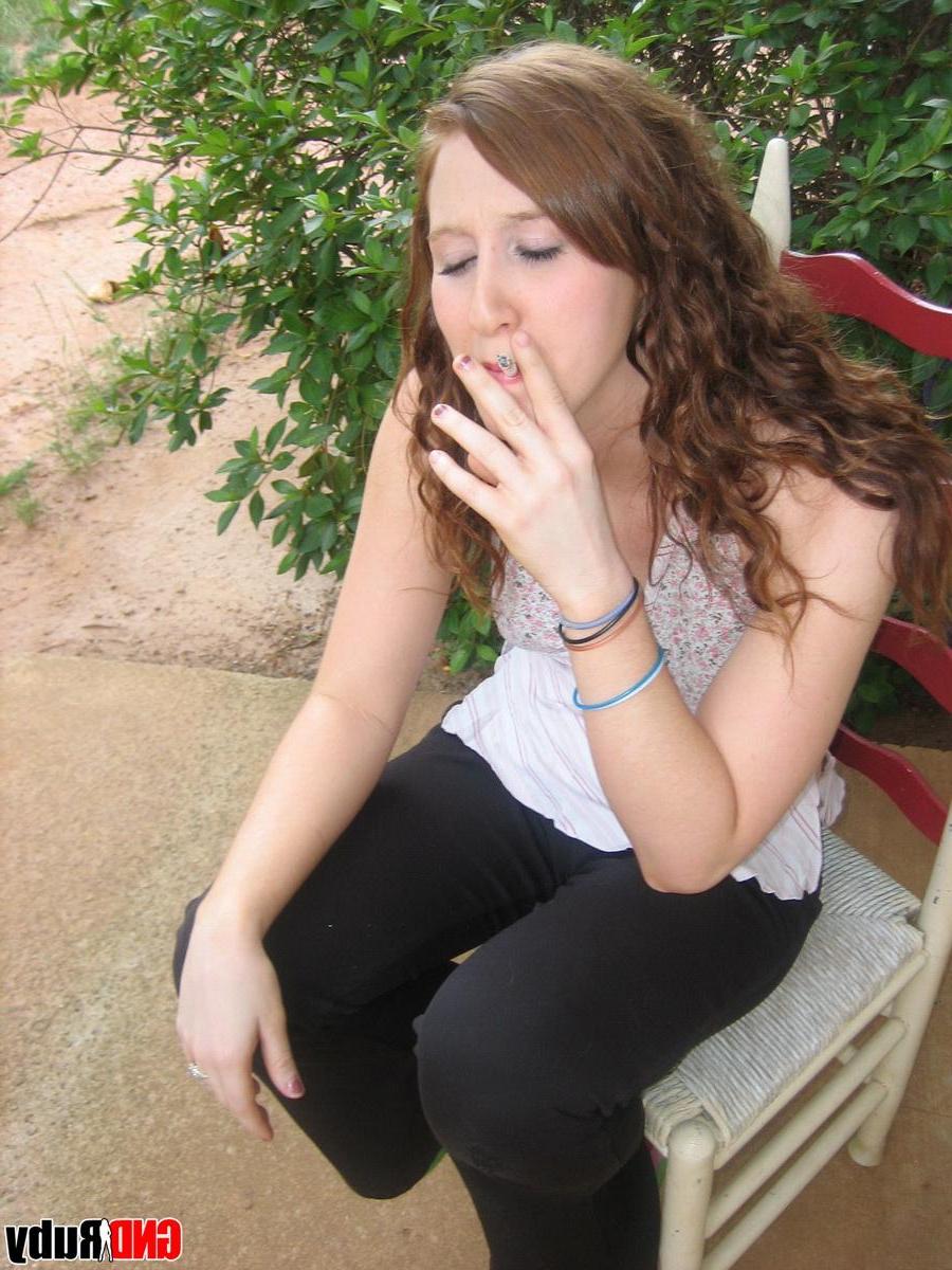 12P Sexy red head teen Ruby takes a smoke break and flashes the camera