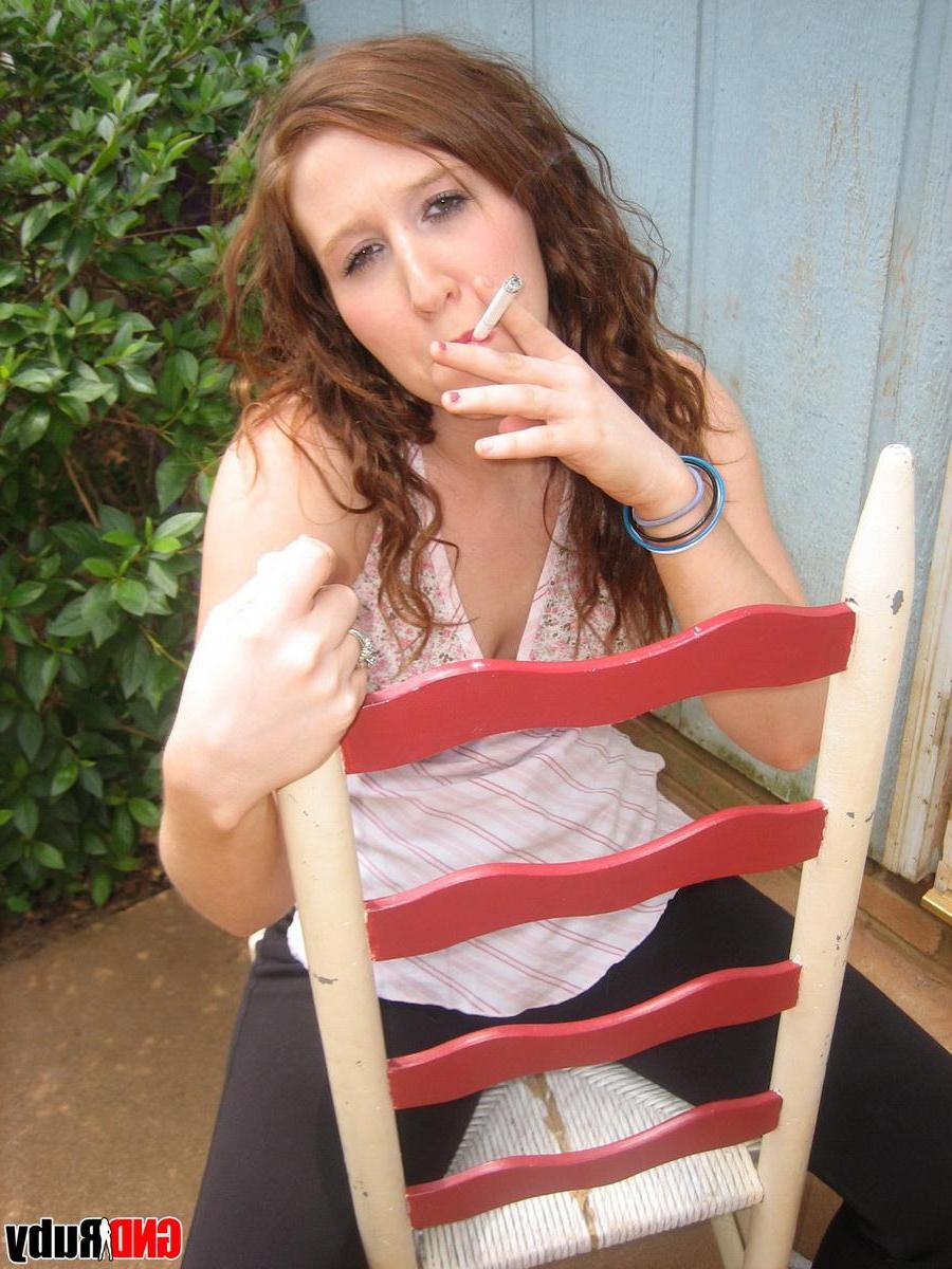 12P Sexy red head teen Ruby takes a smoke break and flashes the camera
