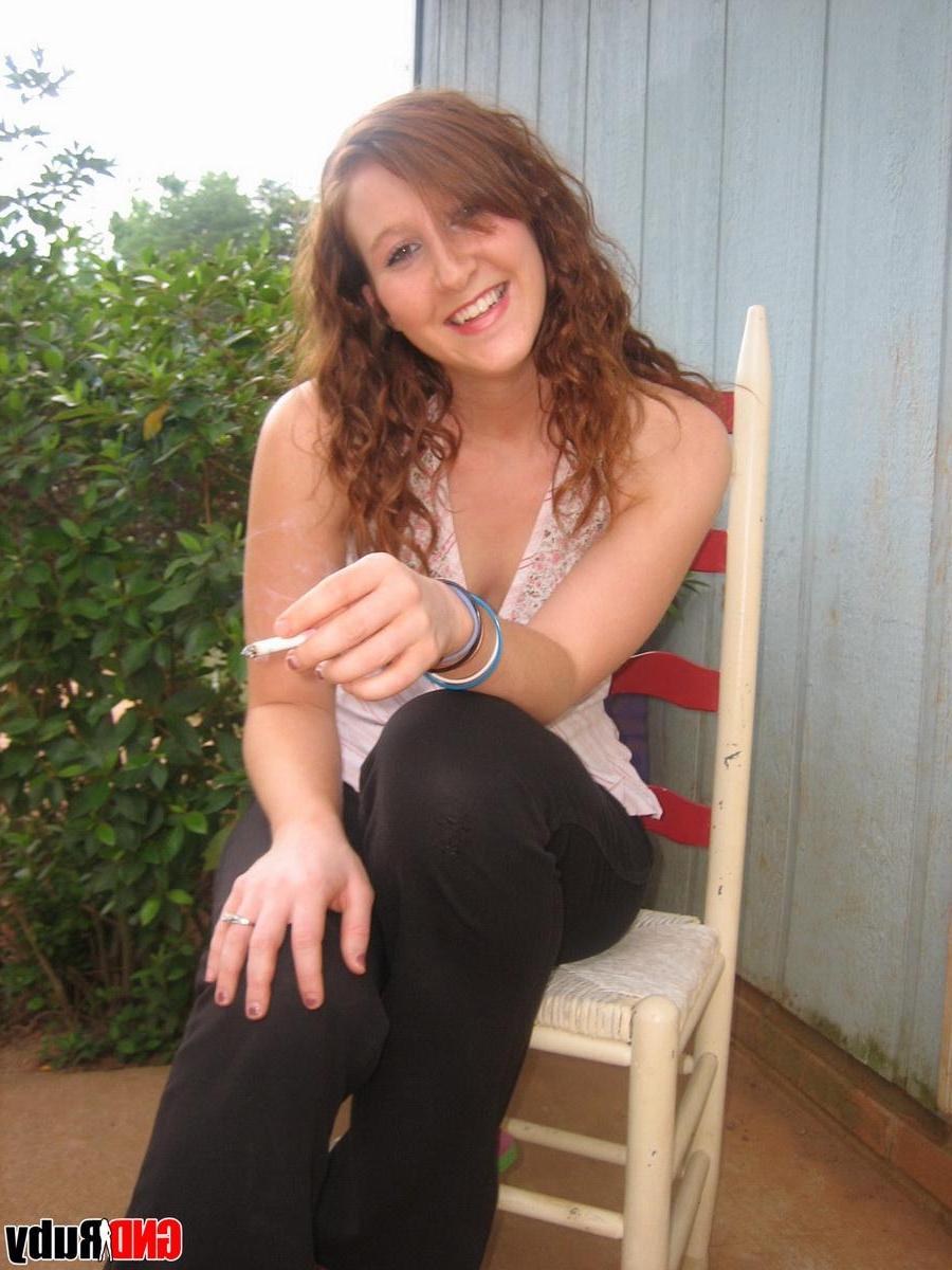12P Sexy red head teen Ruby takes a smoke break and flashes the camera