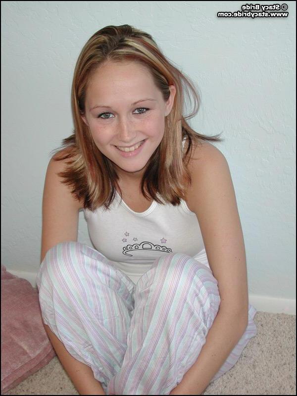 20P Pictures of a cute coed getting nude at home