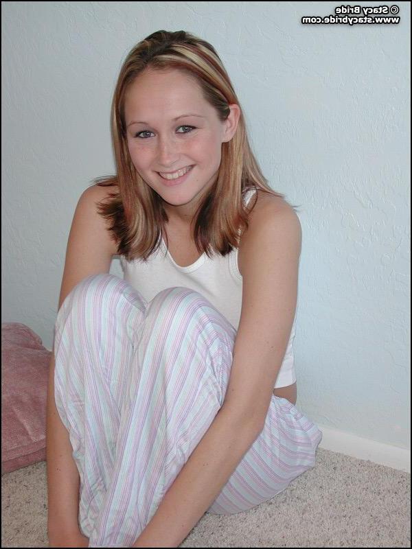 20P Pictures of a cute coed getting nude at home