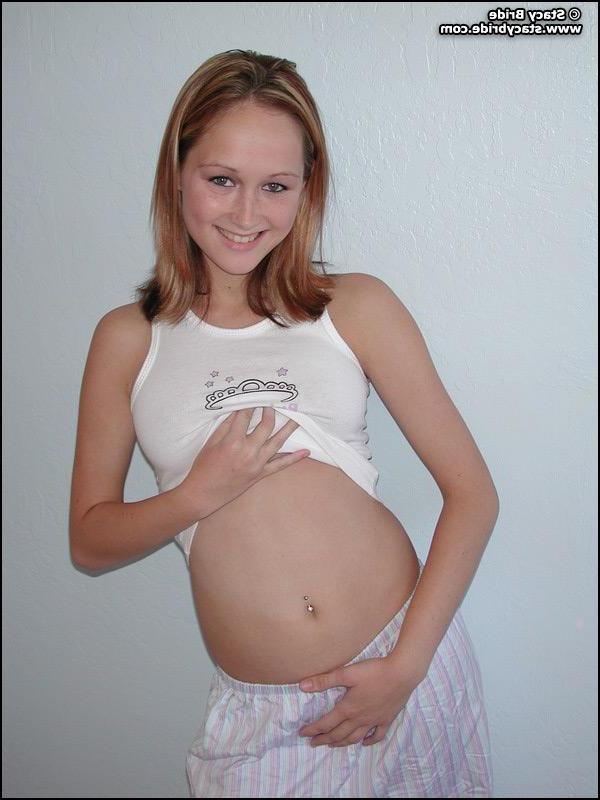 20P Pictures of a cute coed getting nude at home