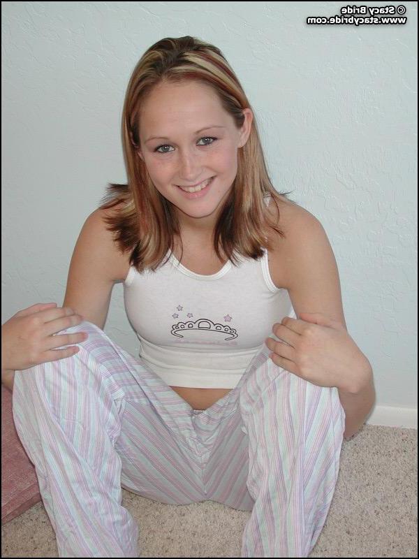 20P Pictures of a cute coed getting nude at home