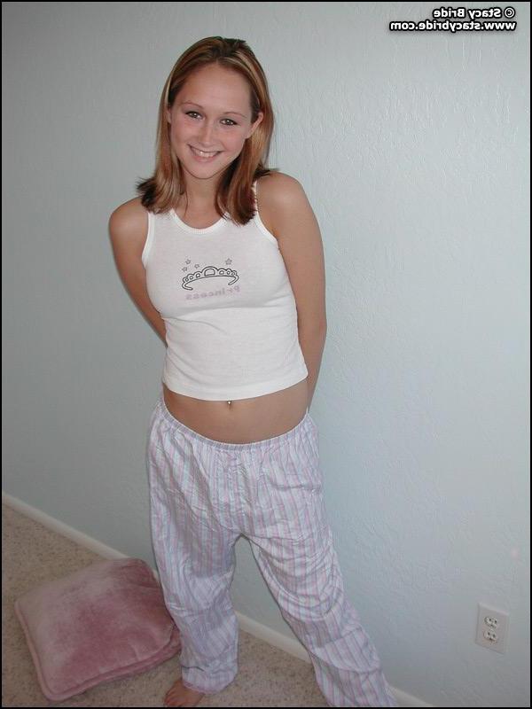 20P Pictures of a cute coed getting nude at home