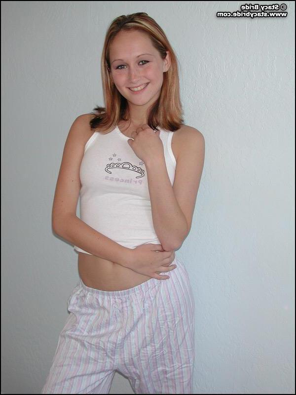 20P Pictures of a cute coed getting nude at home