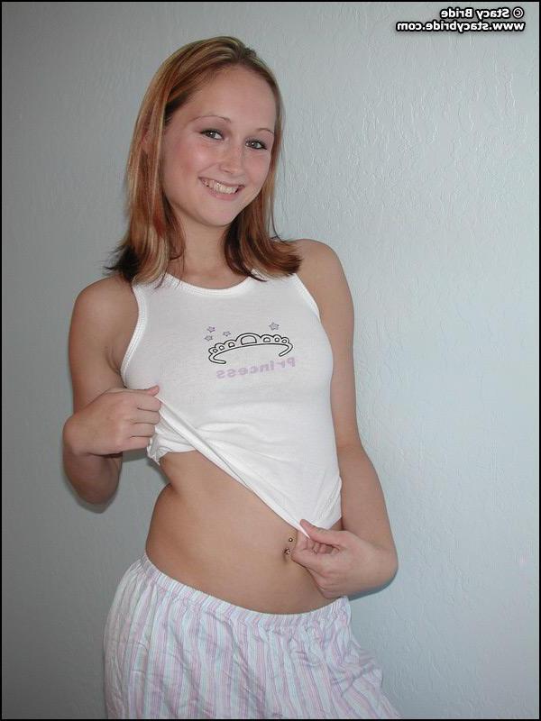 20P Pictures of a cute coed getting nude at home
