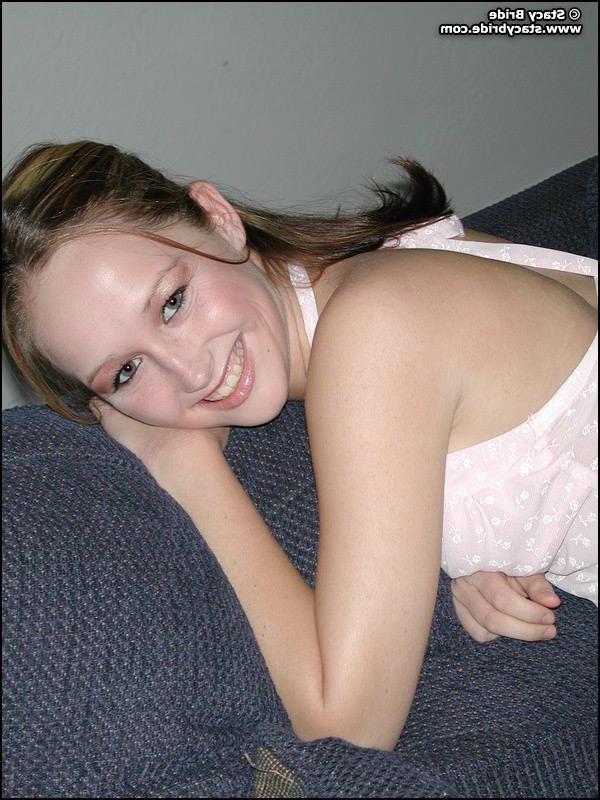 20P Pictures of Stacy Bride getting naked on a couch