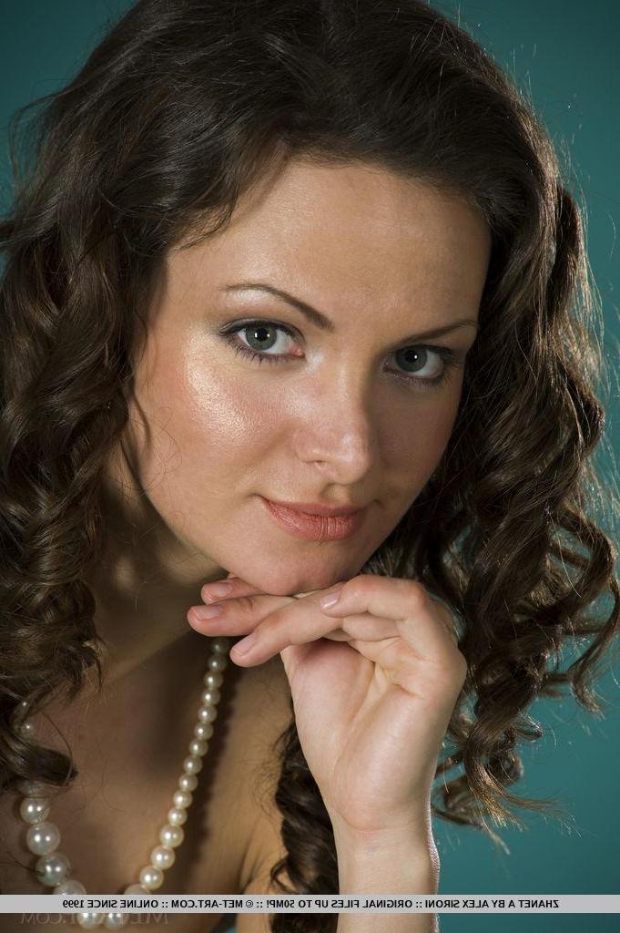 18P Brunette beauty Zhanet A strips naked and shows you her pretty flower