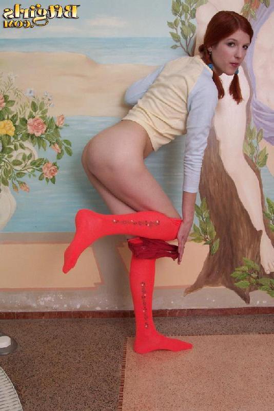 15P Hot redhead teen in pigatils strips naked and shows her pretty feet