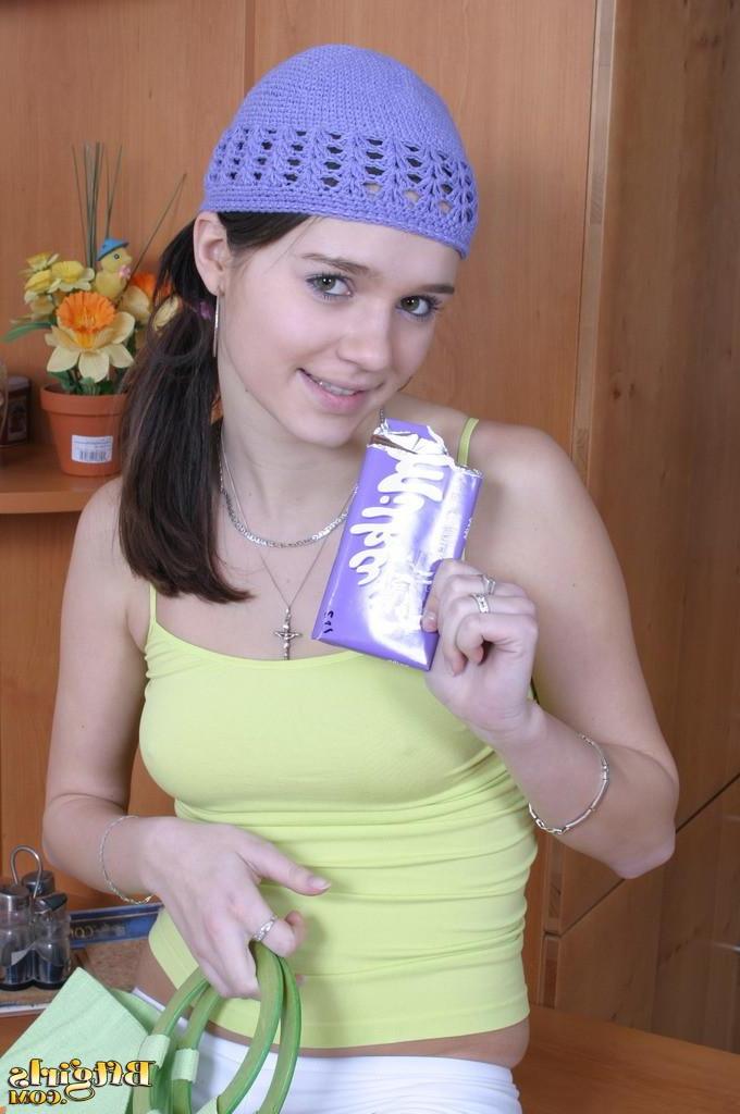 15P Brunette cutie makes a mess with her feet and chocolate