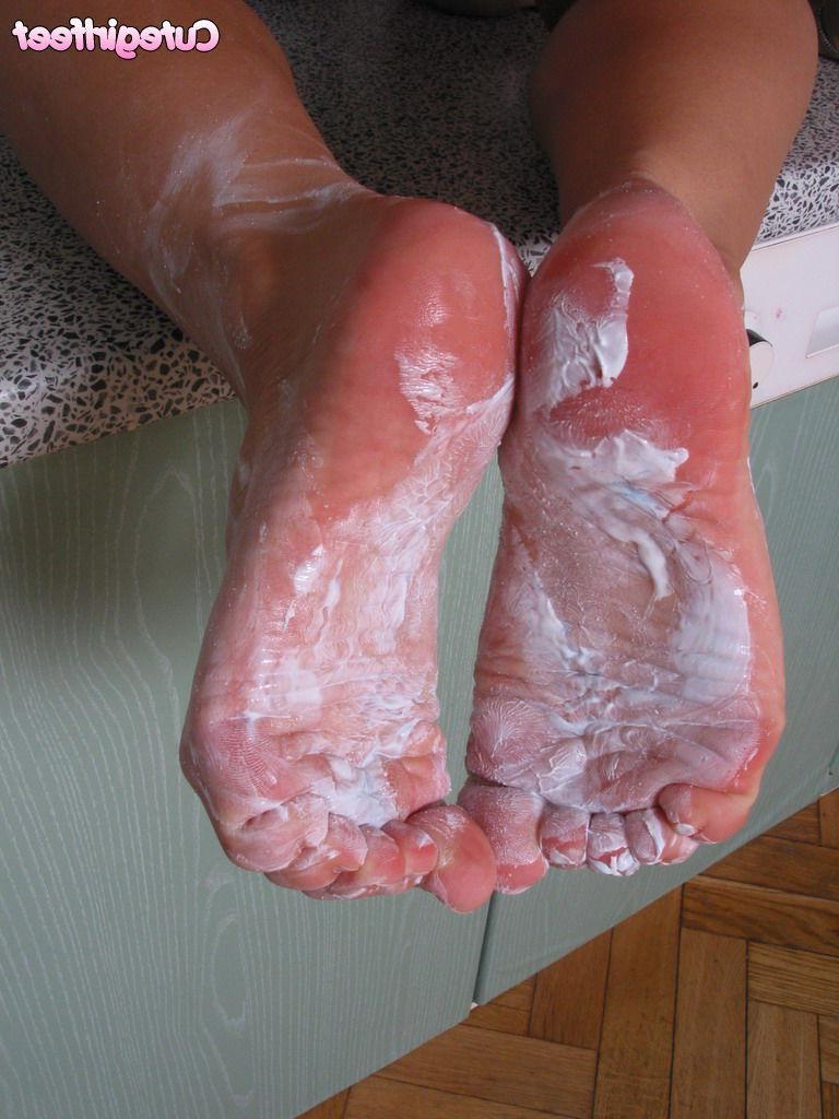 15P Naked brunette teen in pigtails gets her feet all messy just for you