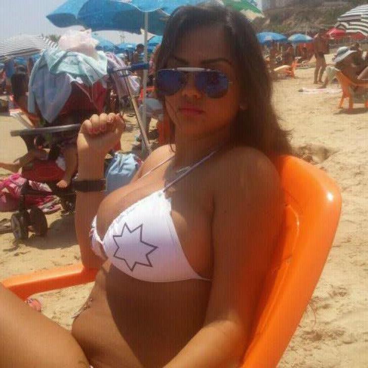 12P Curvy big-tittied babe flaunts her juicy melons while posing