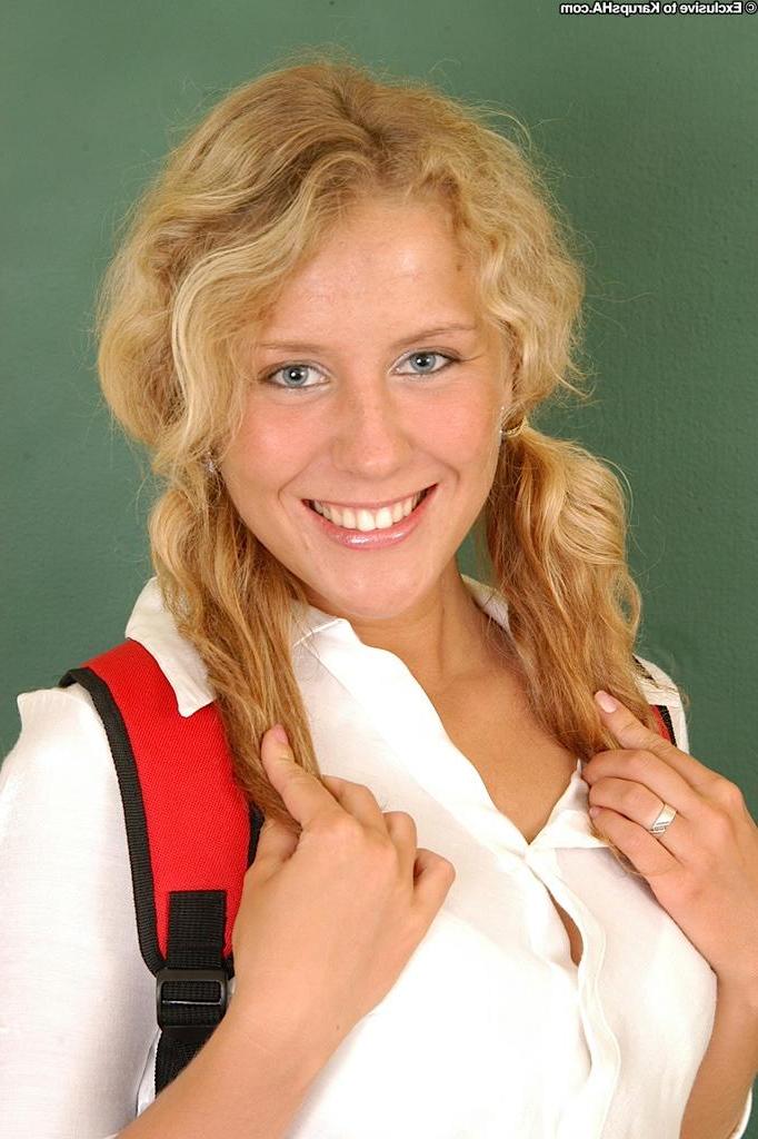 18P Cute schoolgirl Lita shows off her pigtails as she sits naked at her desk