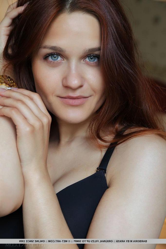 18P Redhead babe Barbora M gets naked and spreads her legs