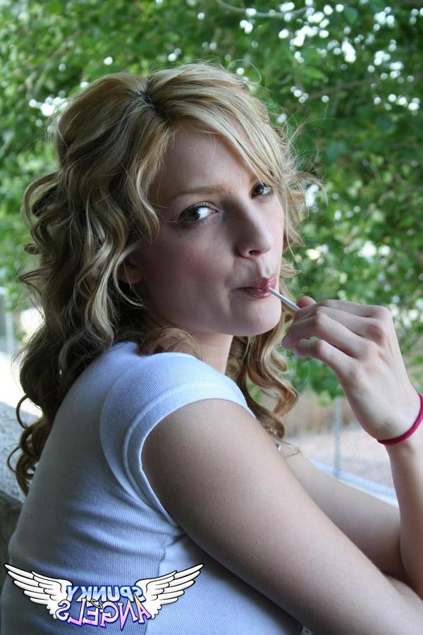 20P Pictures of a cute teen sucking on a lollipop