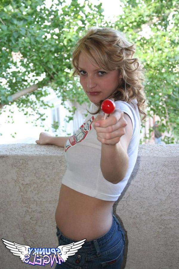 20P Pictures of a cute teen sucking on a lollipop