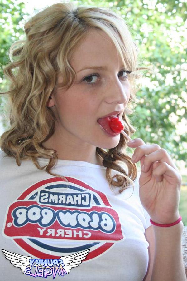20P Pictures of a cute teen sucking on a lollipop