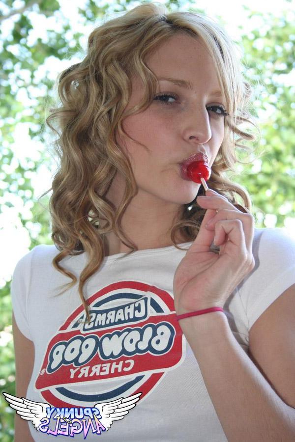 20P Pictures of a cute teen sucking on a lollipop