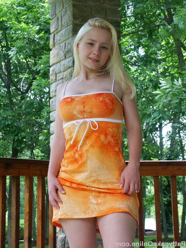 16P Pictures of cute teen girl Pattycake teasing in an orange sun dress