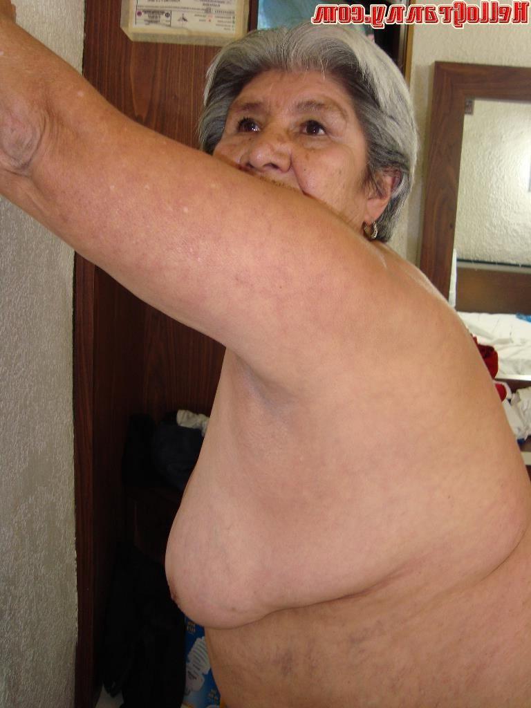 15P Nice granny licks her tits and makes striptease