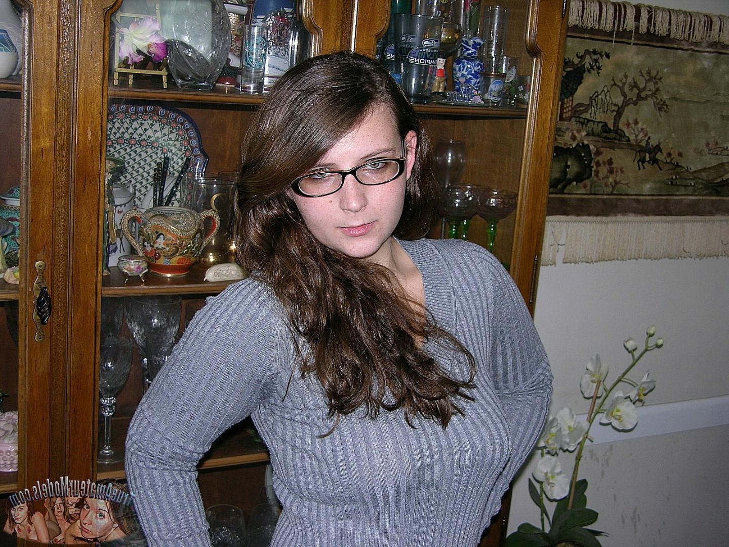16P Brunette woman wearing glasses models nude