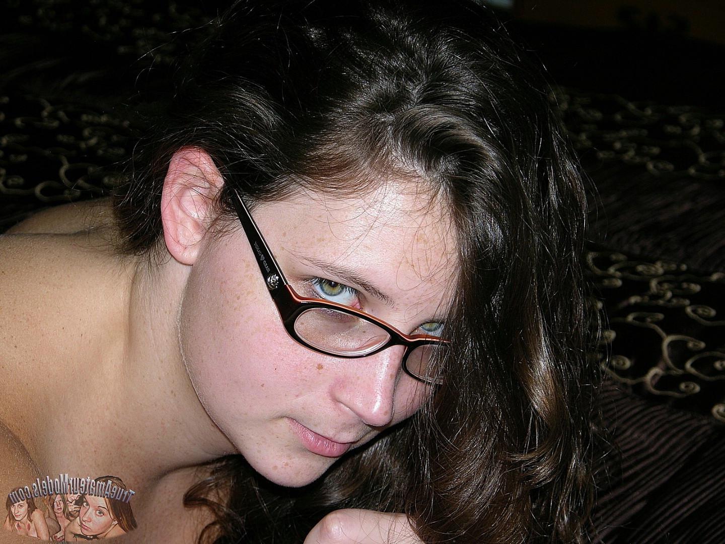 16P Brunette woman wearing glasses models nude