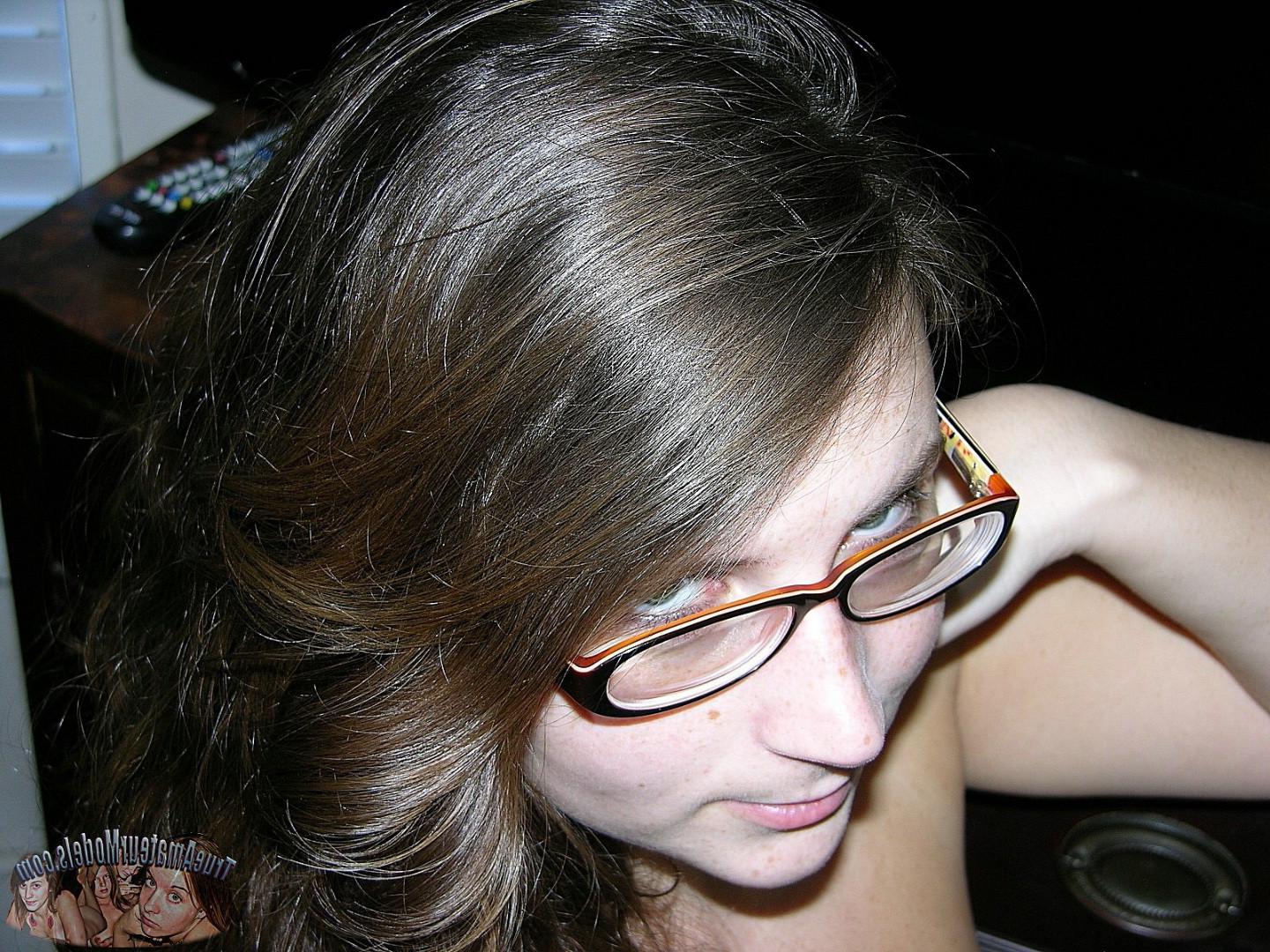16P Brunette woman wearing glasses models nude