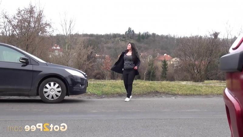 15P Chubby brunette pisses in the middle of the city