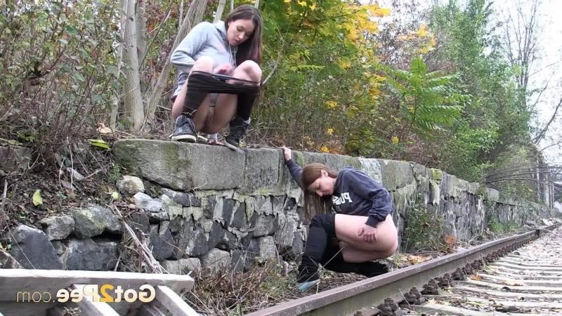 15P Girlfriends both need to piss while walking outside