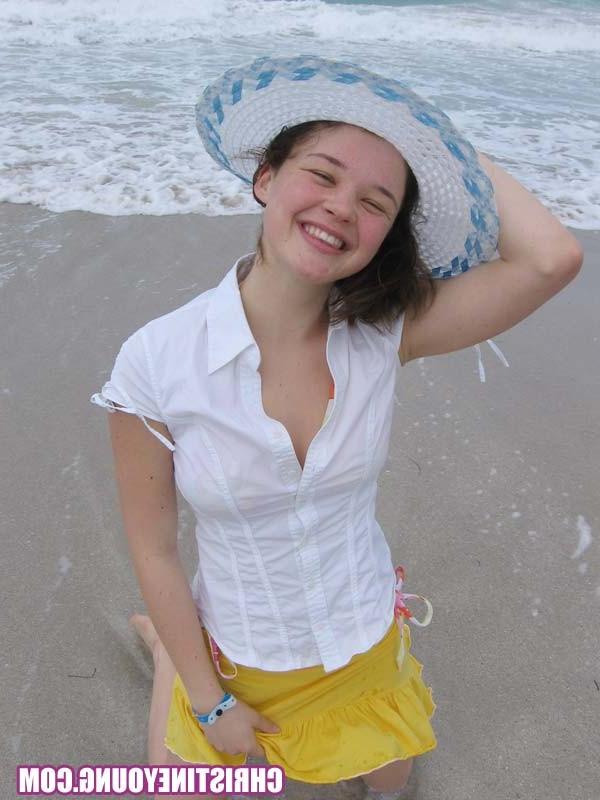 15P Cute young hottie Christine Young teasing on a nice beach