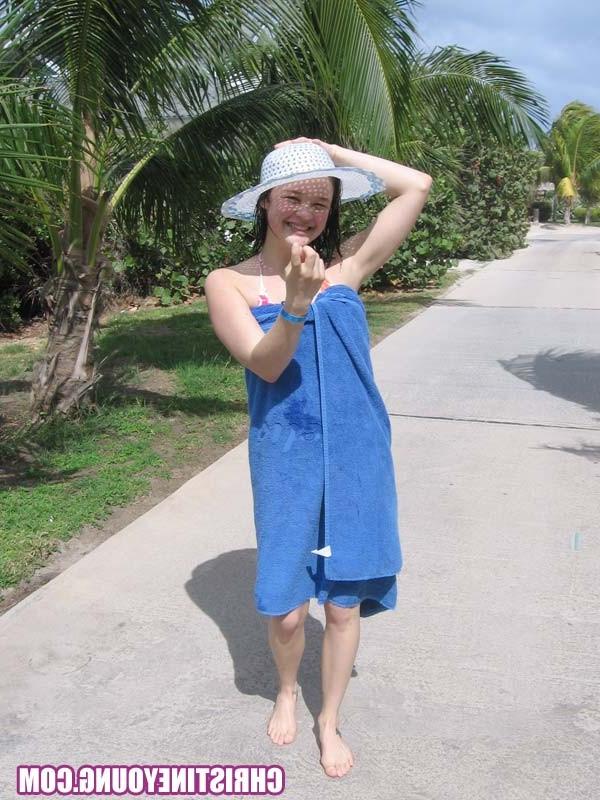 15P Cute young hottie Christine Young teasing on a nice beach