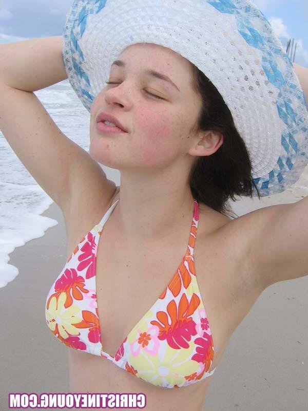 15P Cute young hottie Christine Young teasing on a nice beach