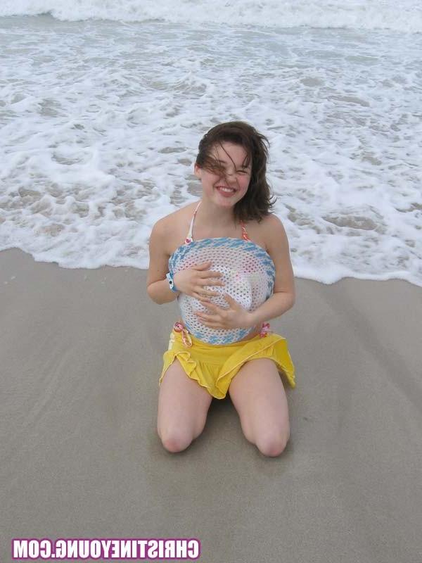 15P Cute young hottie Christine Young teasing on a nice beach
